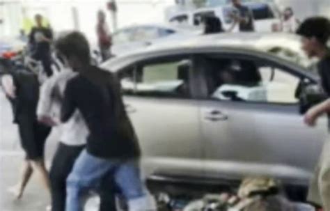 Video shows driver beaten, vehicle vandalized by large group of .